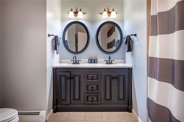 bathroom featuring tile patterned flooring, vanity, a baseboard radiator, and toilet