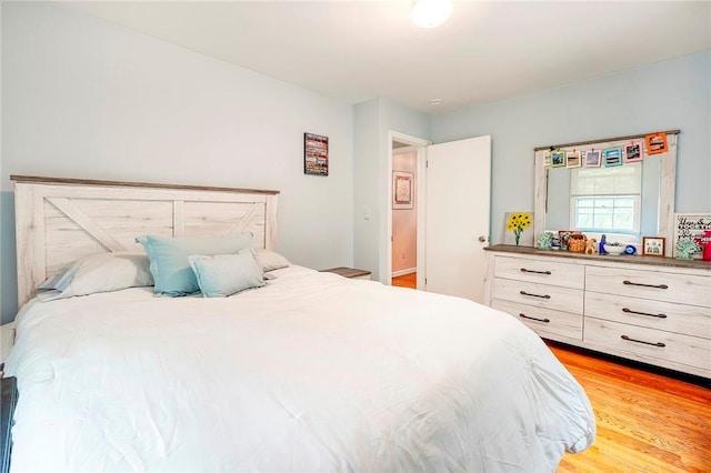 bedroom with light wood-type flooring