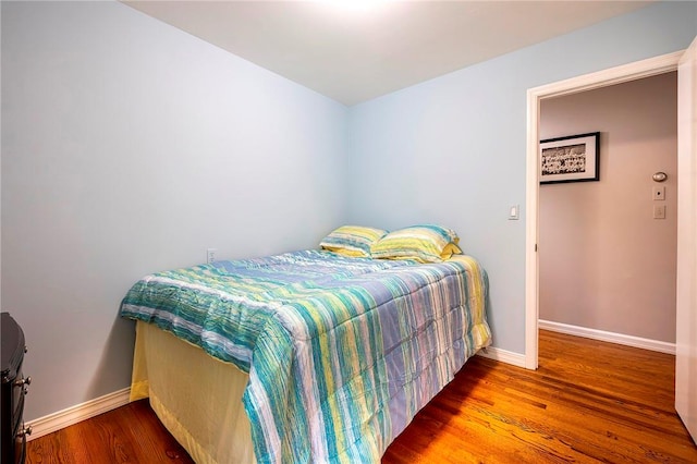 bedroom featuring wood-type flooring