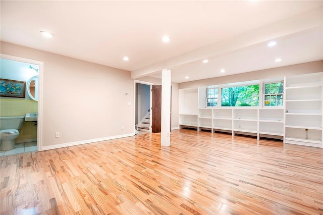 unfurnished living room with light hardwood / wood-style flooring