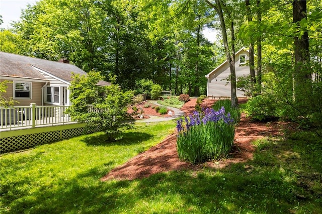 view of yard featuring a wooden deck