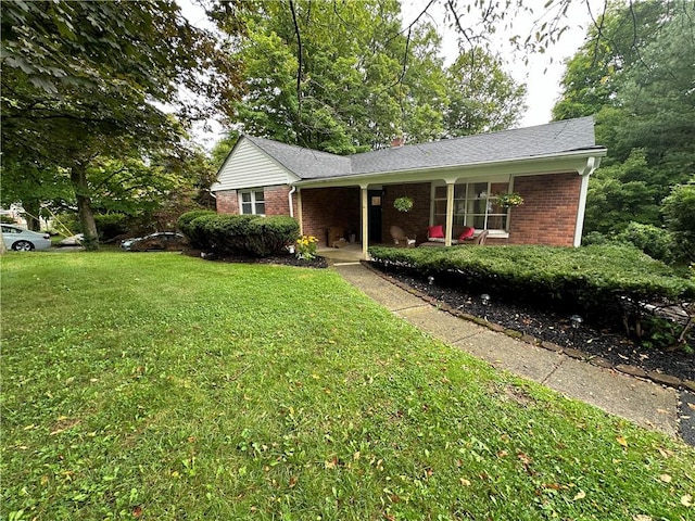 ranch-style home featuring a front yard