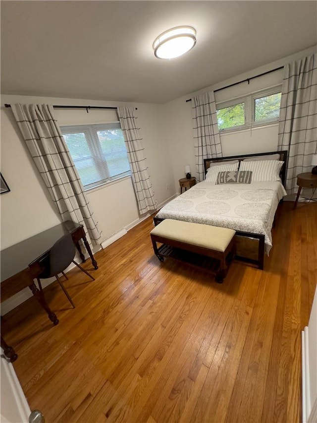 bedroom with hardwood / wood-style flooring