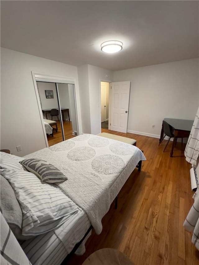 bedroom featuring a closet and hardwood / wood-style flooring