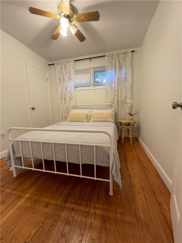 unfurnished bedroom featuring hardwood / wood-style flooring and ceiling fan