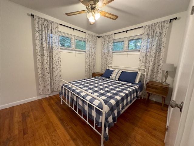 bedroom featuring ceiling fan and dark hardwood / wood-style flooring