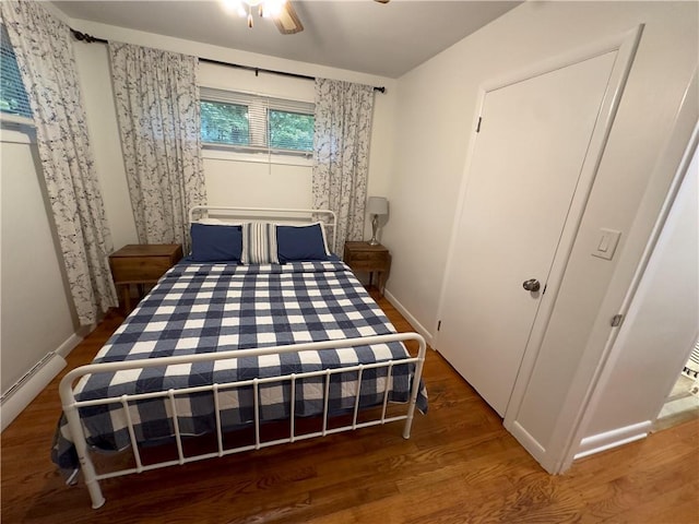 bedroom featuring dark hardwood / wood-style floors and ceiling fan