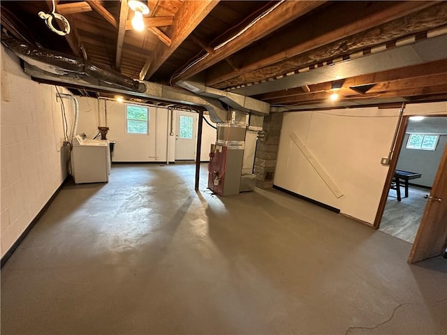 basement featuring washer / clothes dryer and heating unit