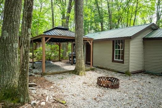 exterior space with a gazebo and a fire pit