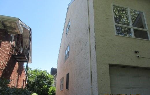 view of side of home with a garage