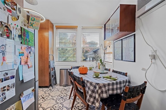 dining area with light tile patterned floors