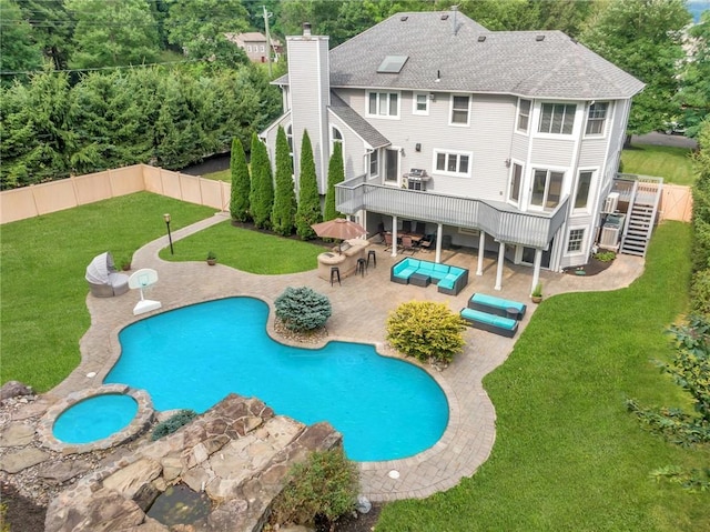 view of pool featuring a yard, a deck, central AC, an outdoor hangout area, and a patio area