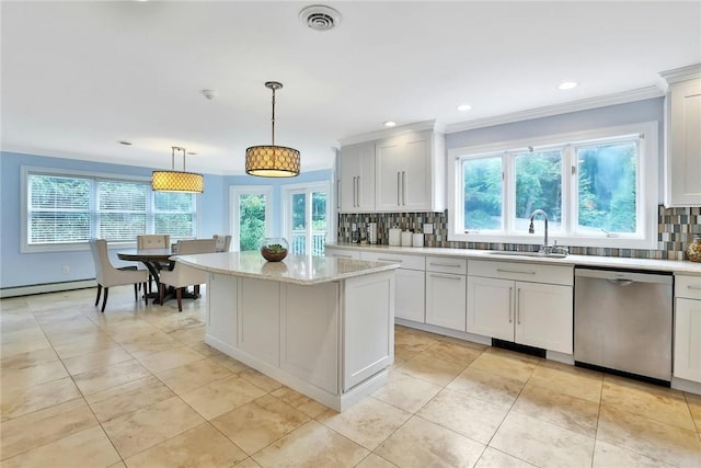 kitchen featuring dishwasher, sink, tasteful backsplash, decorative light fixtures, and white cabinetry