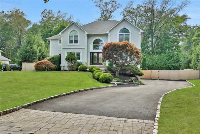 view of front of house featuring french doors and a front yard