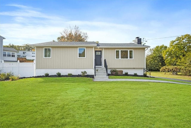 view of front of home with a front lawn