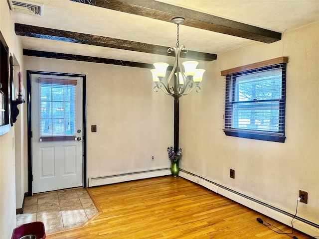 foyer entrance featuring beam ceiling, a chandelier, wood-type flooring, and a baseboard radiator