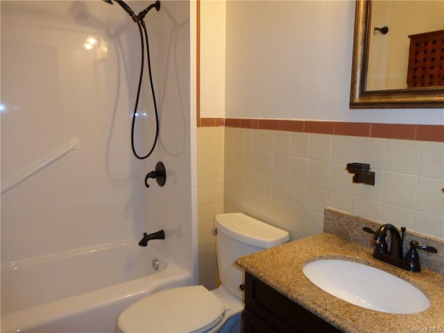 full bathroom featuring tile walls, vanity, shower / bathtub combination, and toilet