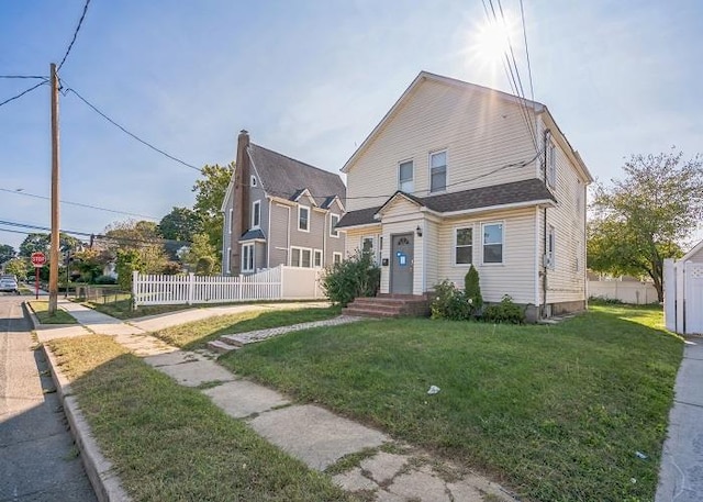 view of front of property with a front lawn