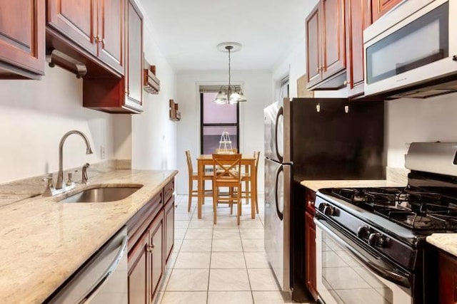 kitchen featuring sink, gas range oven, stainless steel dishwasher, a chandelier, and light tile patterned floors