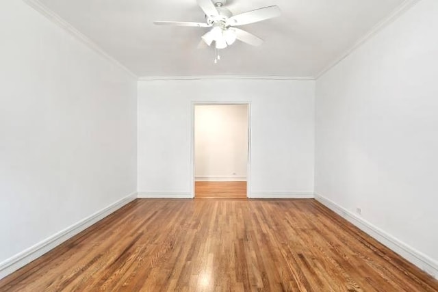 unfurnished room with hardwood / wood-style floors, ceiling fan, and ornamental molding