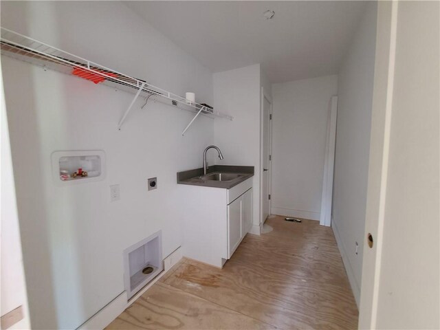 clothes washing area featuring cabinets, washer hookup, hookup for an electric dryer, and sink