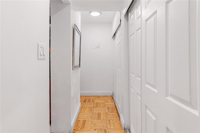 corridor with light parquet floors