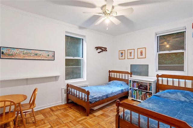 bedroom with ceiling fan, ornamental molding, and light parquet floors