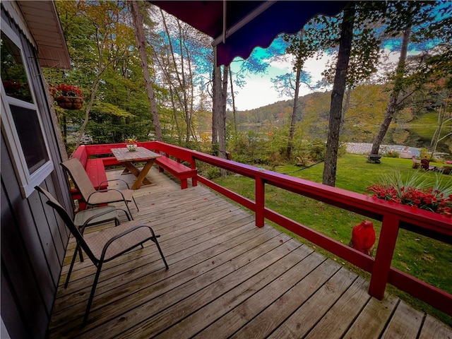 deck featuring a lawn