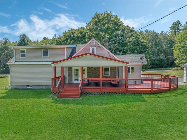 rear view of property with a lawn and a porch