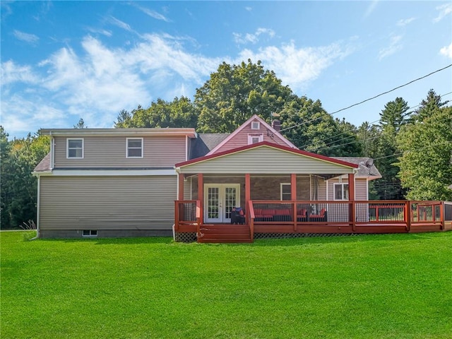 rear view of property with a lawn