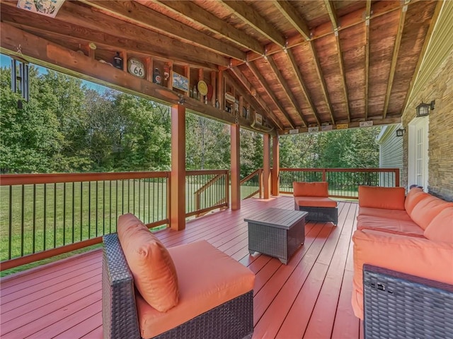 wooden deck featuring an outdoor living space and a yard