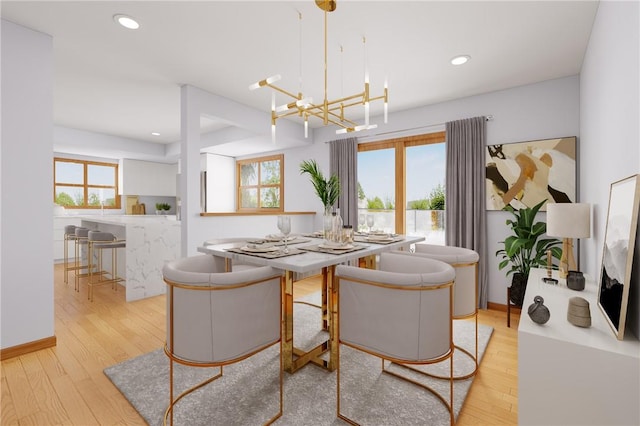 dining room with a wealth of natural light, an inviting chandelier, wood finished floors, and recessed lighting