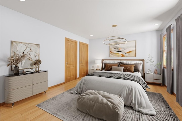 bedroom with light wood-style floors, baseboards, and recessed lighting