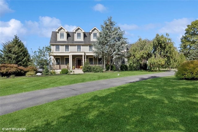 view of front of house featuring a porch and a front lawn