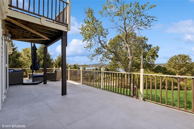 view of patio featuring a balcony