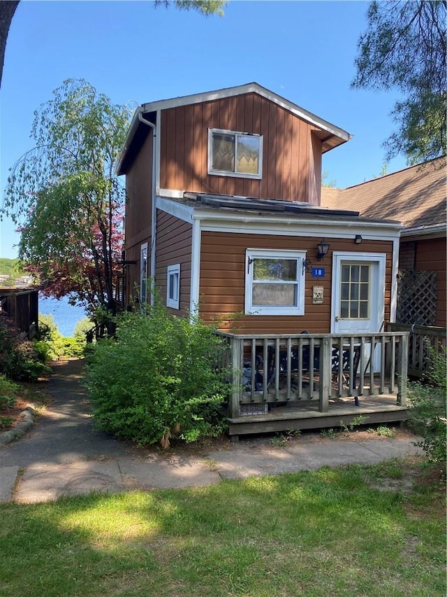 back of house with a wooden deck