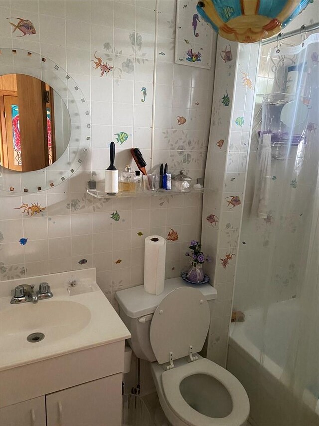 full bathroom featuring toilet, decorative backsplash, shower / bath combo with shower curtain, vanity, and tile walls