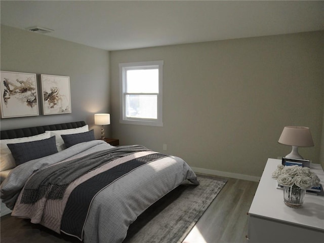 bedroom with dark hardwood / wood-style flooring