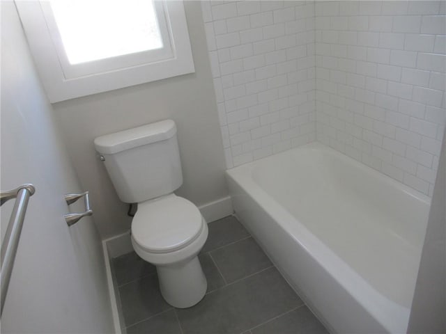 bathroom featuring tile patterned floors and toilet