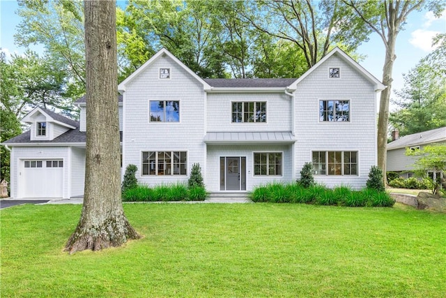 view of front facade with a garage and a front lawn