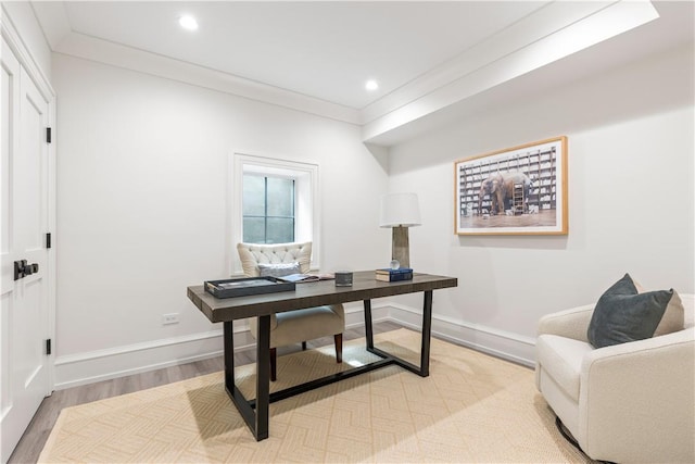 office featuring ornamental molding and light hardwood / wood-style flooring