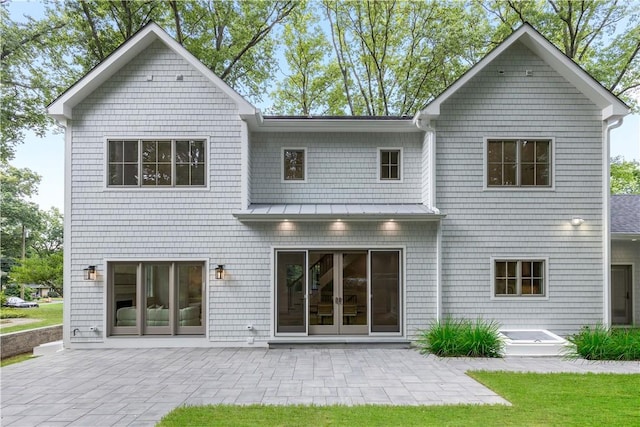 rear view of house featuring a patio area