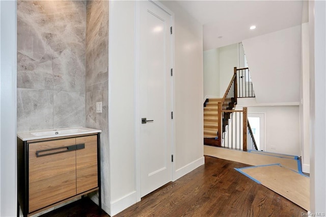 hall with dark wood-type flooring