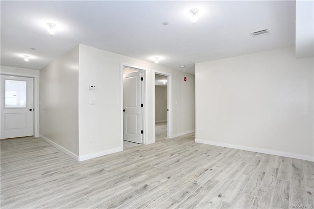 unfurnished room with light hardwood / wood-style floors