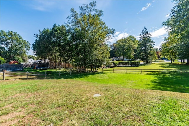 view of yard with a rural view