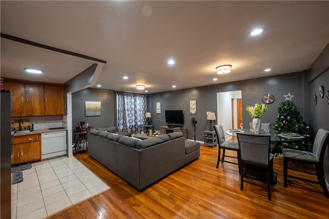 living room featuring sink and light wood-type flooring