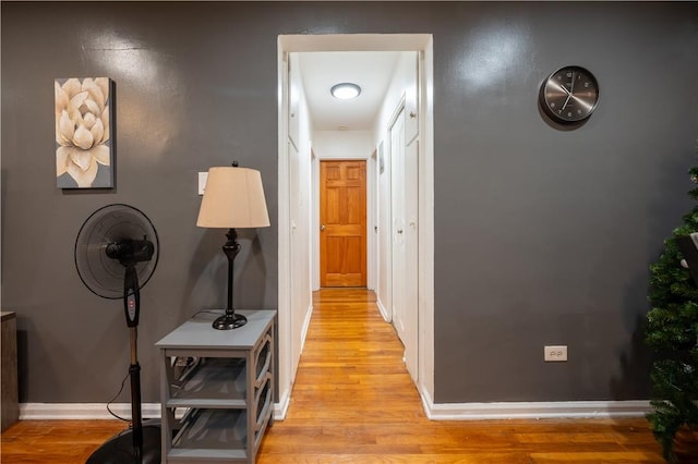 hall with light wood-type flooring