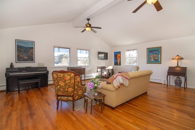 living room with lofted ceiling with beams, baseboard heating, and wood finished floors