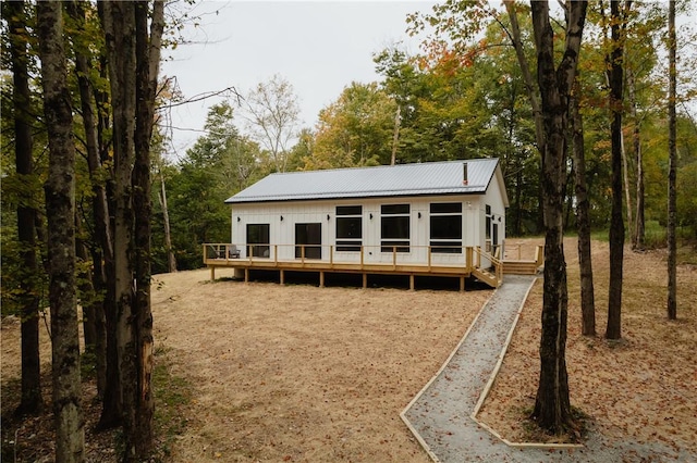 back of property featuring a wooden deck