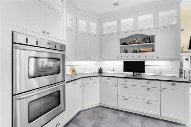 kitchen with white cabinetry and stainless steel double oven